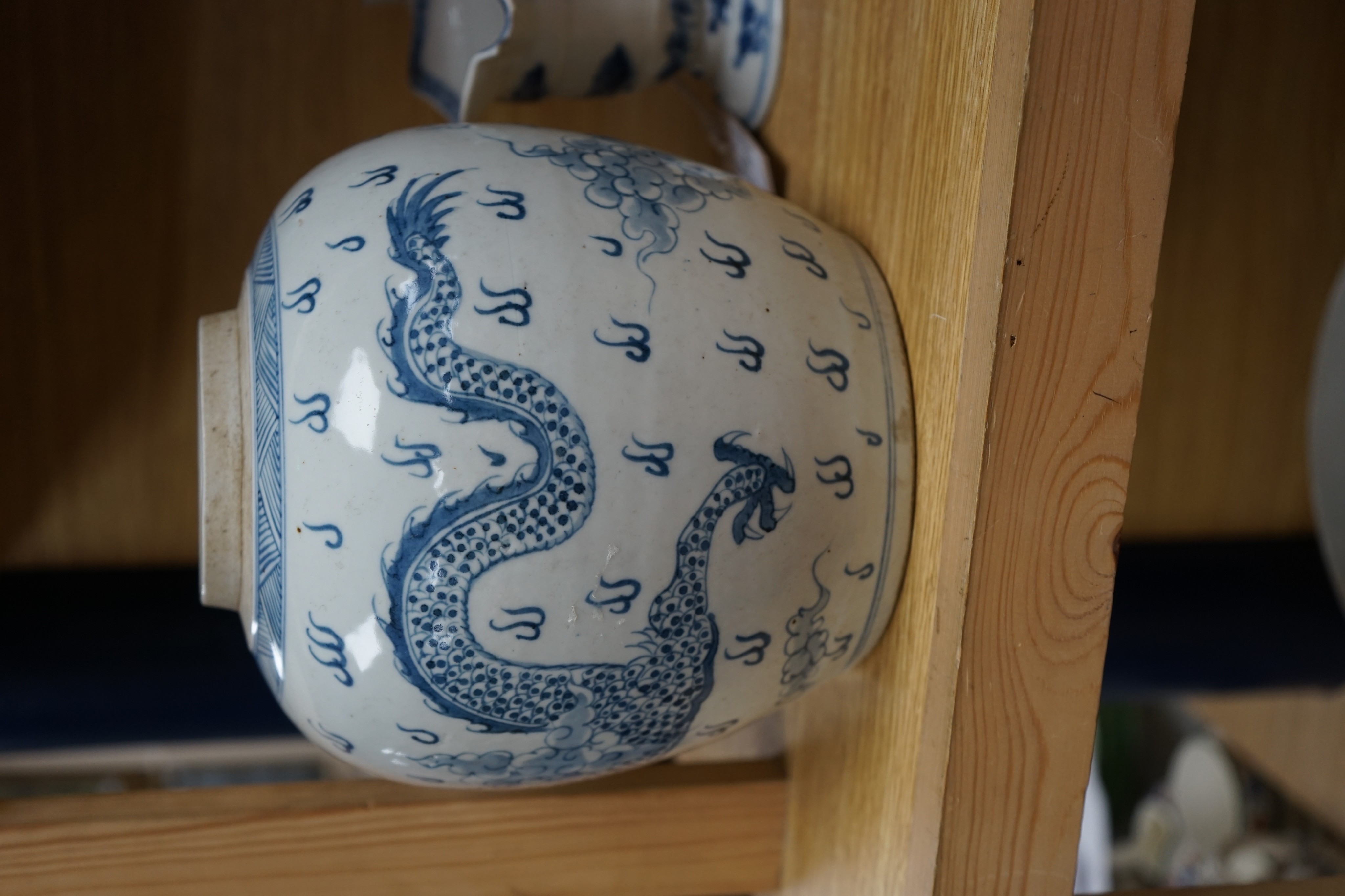 A Chinese blue and white jar, 20cm and a helmet shaped jug, 18th century and later